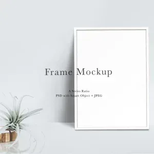 PSD Mockup Frame Interior Design, White interior frame mockup on a light gray wall with a small plant in a copper pot
