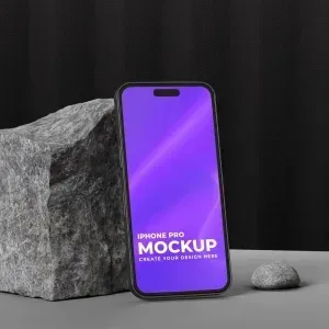 PSD Mockup Screen Phone Display, Phone screen PSD mockup with purple display leaning on a textured stone block