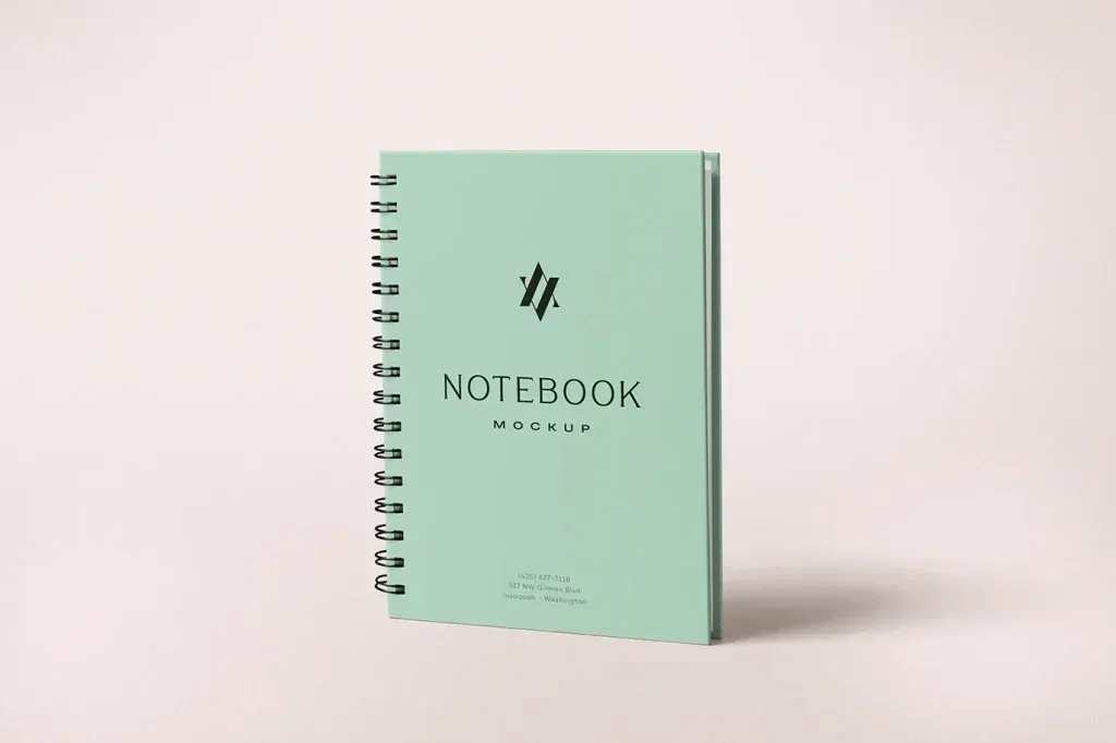 PSD Mockup Spiral Notebook Design, Spiral notebook with mint green cover and black text on light background
