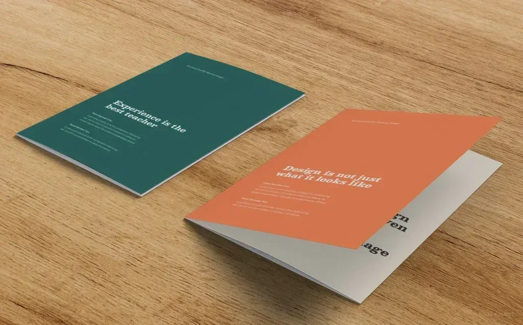 PSD Mockup Two Brochures Perspective, Two brochures with perspective view on wooden surface