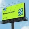 PSD Mockup Billboard for City, Bright billboard mockup on a roadside pole against a blue sky