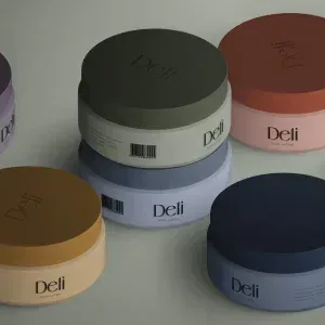 PSD Mockup Isometric Cosmetic Jar, Six round cosmetic jars in different colors arranged on a neutral surface