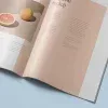 PSD Mockup Magazine Set, Open magazine spread with grapefruit and a peach on a beige page