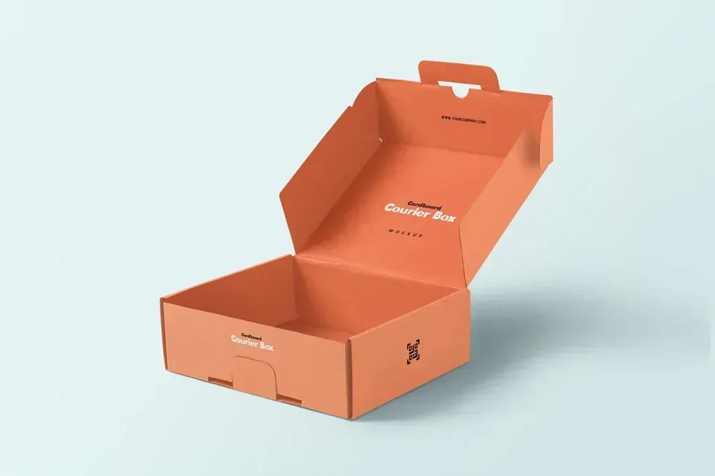 PSD Mockup Mailer Box Packaging, Open orange cardboard courier box with printed labels on a light background