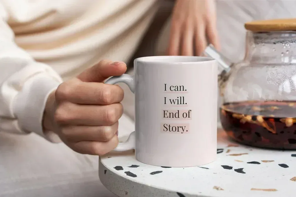 PSD Mockup Mug Lifestyle Set, White mug with a hand holding the handle beside a glass teapot