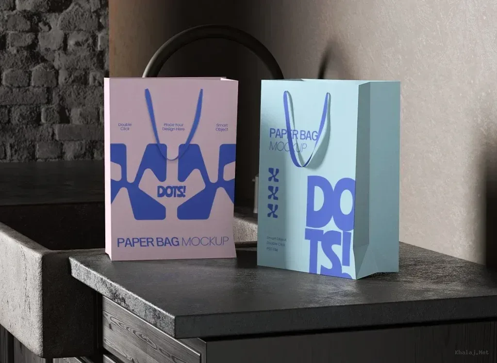 PSD Mockup Paper Bag, Two paper shopping bags with blue handle cords on a dark tabletop