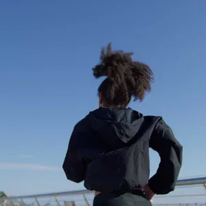 Woman Jogging on Modern City Bridge Stock Footage Woman Jogging on Modern City Bridge Stock Footage