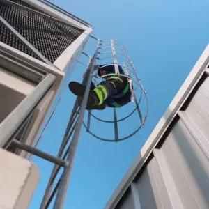 Industrial Worker Climbing Caged Ladder Stock Footage Industrial Worker Climbing Caged Ladder Stock Footage
