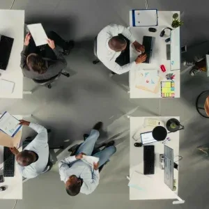 Bird’s-Eye View of Diverse Professionals in Modern Office Stock Footage Bird’s-Eye View of Diverse Professionals in Modern Office Stock Footage