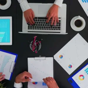 Bird’s Eye View of Business Team Analyzing Financial Charts Stock Footage Bird’s Eye View of Business Team Analyzing Financial Charts Stock Footage