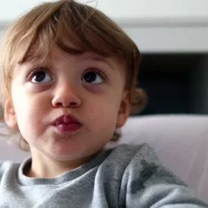 Young Boy Eating and Pointing Up at Home Stock Footage Young Boy Eating and Pointing Up at Home Stock Footage