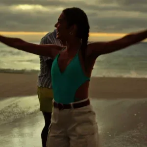 Young Couple Celebrating with Sparklers on Tropical Sunset Beach Stock Footage Young Couple Celebrating with Sparklers on Tropical Sunset Beach Stock Footage