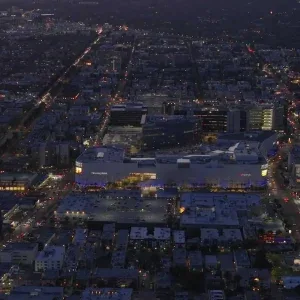 Aerial 4K Vertical of Glowing Cityscape at Sunset Stock Footage Aerial 4K Vertical of Glowing Cityscape at Sunset Stock Footage