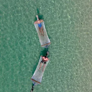Aerial 4K of Hammock Over Clear Water on Koh Kood Island Stock Footage Aerial 4K of Hammock Over Clear Water on Koh Kood Island Stock Footage