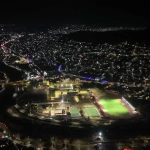 Aerial Night City Glowing Sports Fields Stock Footage Aerial Night City Glowing Sports Fields Stock Footage