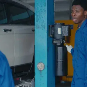 Two Male Mechanics in Auto Repair Shop Stock Footage Two Male Mechanics in Auto Repair Shop Stock Footage