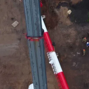 Aerial Construction Workers Striped Tower Stock Footage Aerial Construction Workers Striped Tower Stock Footage