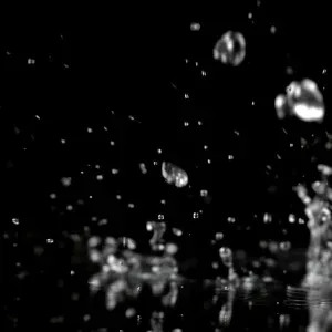 Slow Motion Water Droplets on Dark Stock Footage Slow Motion Water Droplets on Dark Stock Footage
