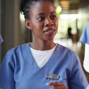 Smiling Nurse with Tablet in Hospital Stock Footage Smiling Nurse with Tablet in Hospital Stock Footage