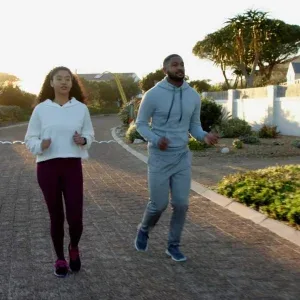 Jogging Couple Suburban Sunset Stock Footage Jogging Couple Suburban Sunset Stock Footage