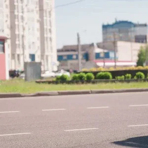 Vehicles on Sunny City Road Stock Footage Vehicles on Sunny City Road Stock Footage